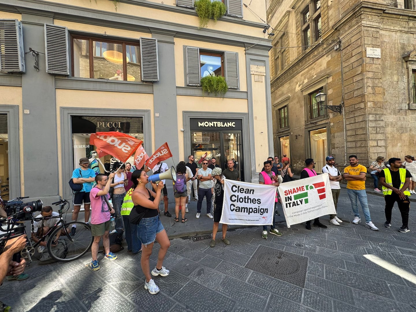 Labour rights campaigners stage a protest outside a Montblanc store.