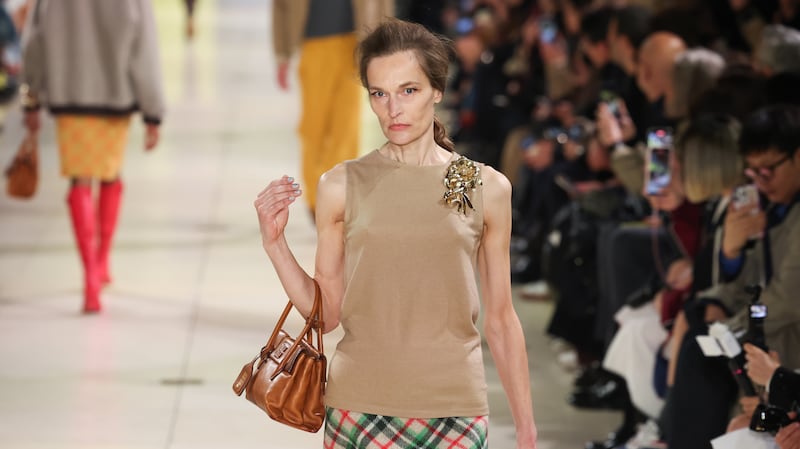 A model walks down the runway in the Miu Miu Autumn/Winter 2025 show.